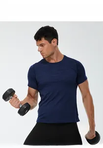 Detail of dark blue camo sport t-shirt and black leggings with model holding dumbbells