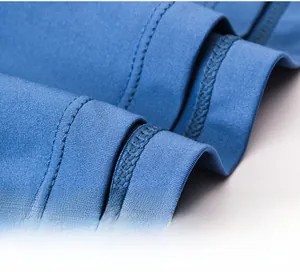 Macro shot of bright blue tennis skirt showing double-stitched hem and inner lining texture