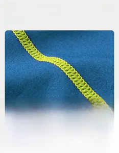 Close-up of durable flatlock stitching on blue quick-dry compression sports shirt