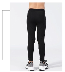 Rear view of boys athletic compression pants in black with high-elastic performance fabric