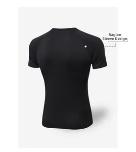 Detail view of the black men's compression shirt featuring raglan sleeve design for mobility