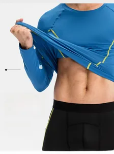 Detail of blue compression shirt fabric showing moisture-wicking and breathable texture