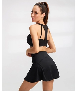 Detail of high-waist black sports skirt and breathable mesh back yoga bra set