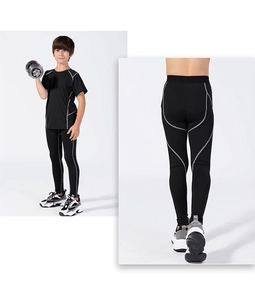 Detail of children's sports leggings with grey functional stitching and high elastic fabric
