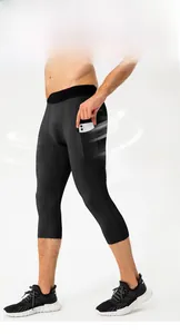 Detail view of men's quick-dry compression 3/4 pants with functional side phone pocket