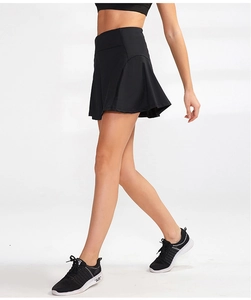 Side view of black high-waisted athletic skort with pleated A-line cut for tennis