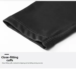 Detailed view of elastic snug cuffs and precision flatlock stitching on men's sports top