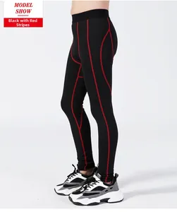 Detail of boys compression pants with high-elastic fabric and red contrast stitching