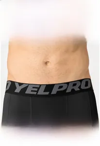 Close-up of men's compression pants featuring a high-elastic waistband with printed logo