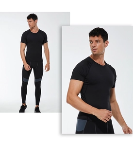 Detail view of men's quick-dry compression t-shirt and leggings with side grey panels