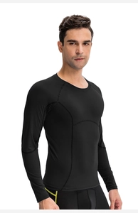 Detail of flatlock seams on men's black compression long sleeve running shirt