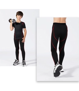 Detail of boys compression leggings with ergonomic red stitching and high-elastic fabric