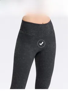 Close-up of high-waisted yoga leggings featuring dark grey marble print and elastic fabric
