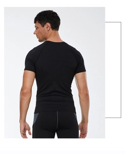 Back view of men's quick-dry black compression shirt showing ergonomic seams and fit
