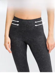 Detail of high waisted yoga leggings in dark grey marble print with tummy control design