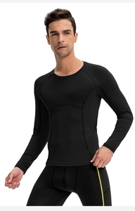 Close-up of black compression gym top showing raglan sleeves and flexible athletic fabric
