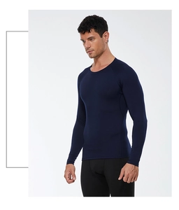 Detailed side view of navy blue men's compression shirt showing stretch fabric and fit