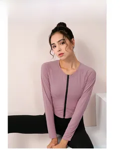 Top sportivo con zip da donna in rosa polvere con tessuto elastico tecnico