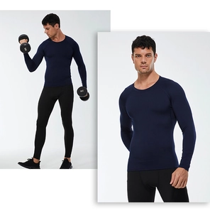 Detail of men's blue compression shirt and black leggings set for athletic training