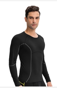 Detail of ergonomic stitching on men's black compression shirt for muscle fit
