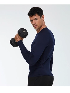 Men's compression long sleeve showing side view of dumbbell training and moisture-wicking fabric