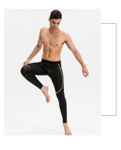 Détail du pantalon de compression PRO pour hommes avec rayures jaunes et tissu élastique
