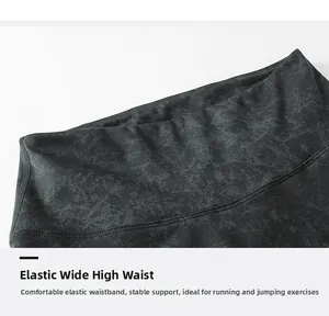 Detail of high-waist yoga leggings featuring dark grey marble pattern and wide waistband