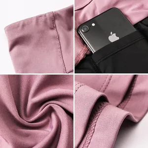 Macro detail of high-waist sports skirt with functional side pocket for smartphone