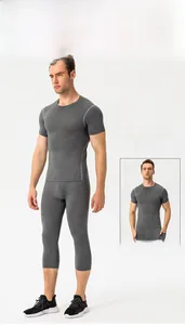 Close-up of men's high-elastic grey compression set including short sleeve T-shirt and tights