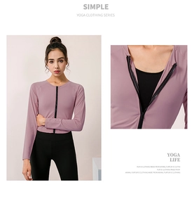 Dettaglio maglia da yoga lilla con zip da donna, colletto dritto e maniche a raglan