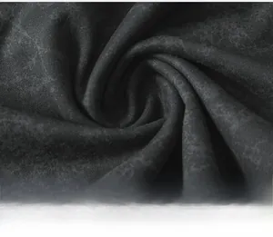 Close-up of seamless yoga pants fabric with dark cloud pattern and soft matte texture
