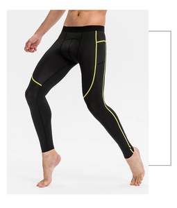 Détail de legging de compression homme avec poche latérale et coutures jaunes contrastées