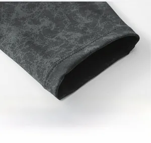 Detail of marble pattern yoga pants showing the elastic cuff with double stitching