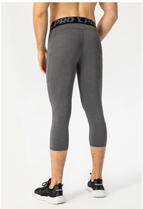 Back view of men's heather grey compression capri pants with pro elastic waistband