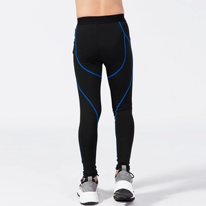 Boys' black compression sports tights with blue stitching for running and fitness training