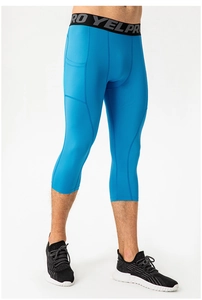 Close-up of men's compression shorts with side pocket and elastic waistband detail