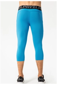 Detail view of men's blue 3/4 compression leggings with side pocket and elastic waistband