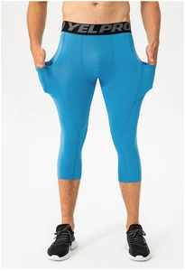 Detail view of sky blue compression pants with side pockets and elastic waist for gym workout