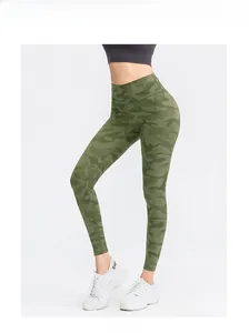 Detail of high-waisted yoga leggings featuring green camo print and seamless fit fabric
