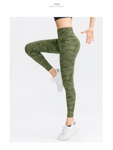 Detail of high-waist women's fitness leggings with green camouflage print