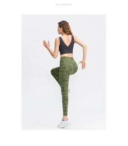 Detail of high-waisted camo print leggings and V-neck sports bra on a running model