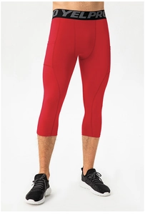 Detailed view of red compression 3/4 pants with elastic waistband and side phone pocket
