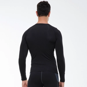 Men's black quick-dry compression long sleeve shirt showing ergonomic back fit and fabric