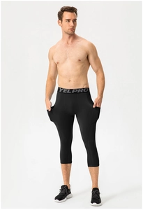 Detail view of men's athletic compression leggings with side pockets and elastic waistband