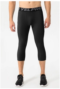 Detail of men's black 3/4 compression leggings with side pocket and elastic waistband