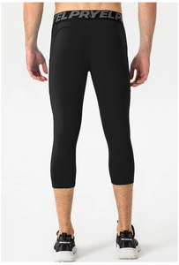 Back view of men's black compression 3/4 pants showing fit and wide elastic waistband