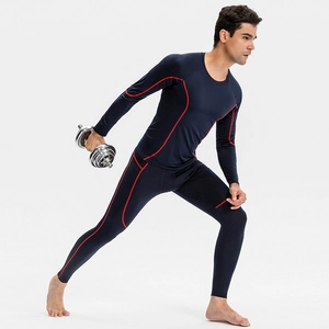 Men's compression long sleeve and pants set in navy blue with red stitching for gym fitness