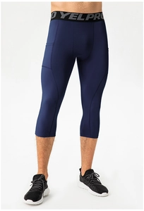 Detail shot of men's navy blue quick-dry compression capris with functional side pocket