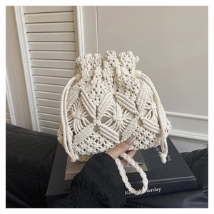 Detail of handmade cream woven bucket bag showing intricate bohemian textures