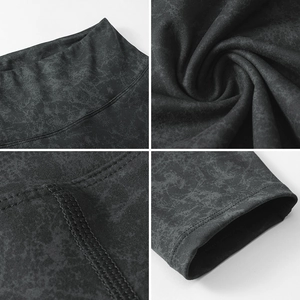 Detail view of high waist waistband and flatlock stitching on gray marble yoga leggings